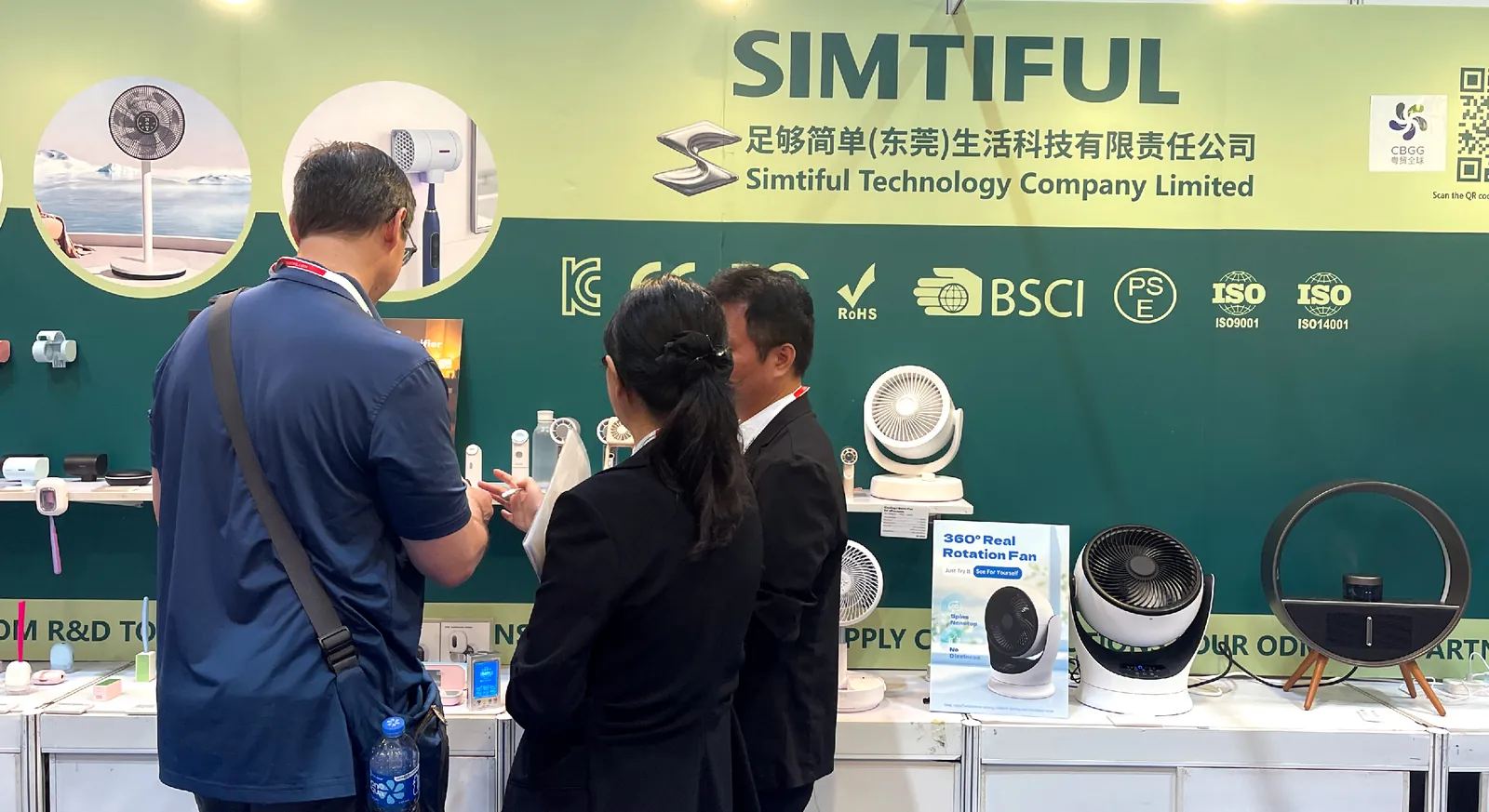Buyers reviewing SIMTIFUL products at the booth
